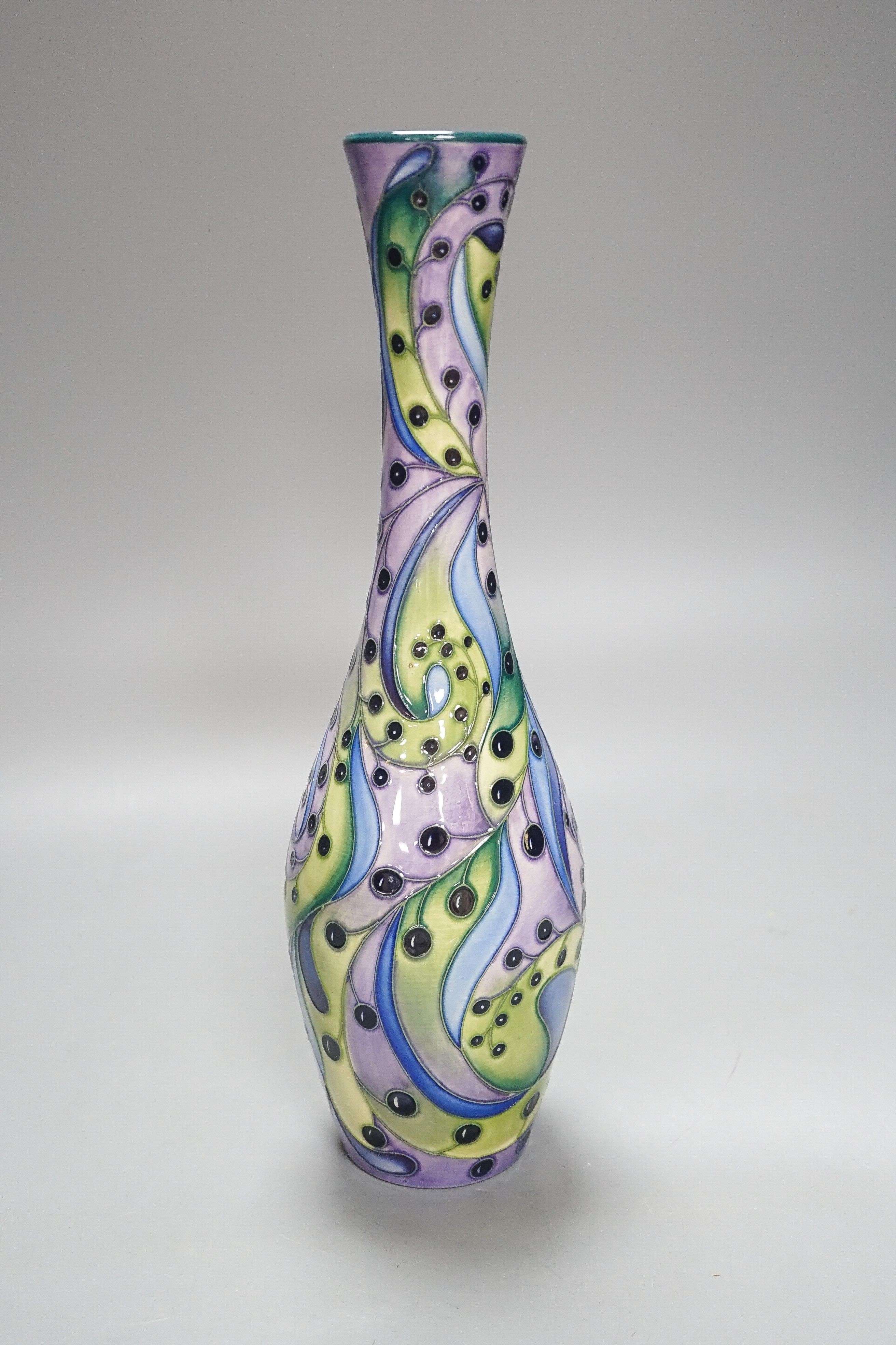 A Moorcroft bottle vase, stylised berries 31cm